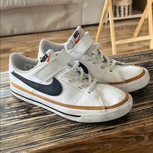 Nike Kids White Sneakers with Black Swoosh and Brown Accent